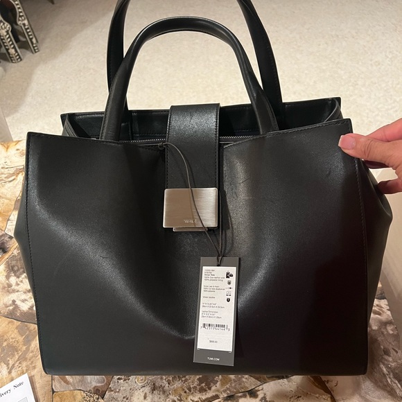 Tumi Handbags - Tumi black leather Vivian tote